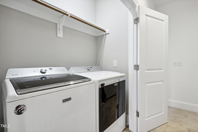 1602 Bowery Dr, Raleigh, NC 27607 - laundry room with washer and clothes dryer, light carpet, and baseboards