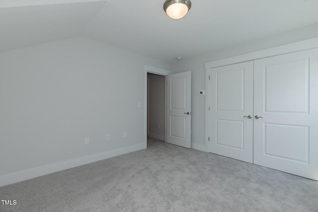1739 Old Fields Blvd, Haw River, NC 27258 - unfurnished bedroom featuring carpet, baseboards, a closet, and vaulted ceiling