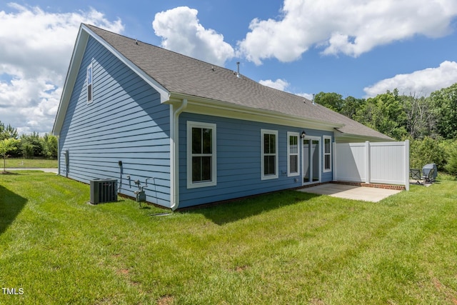 1739 Old Fields Blvd, Haw River, NC 27258 - back of property with central AC, a patio, and a shingled roof