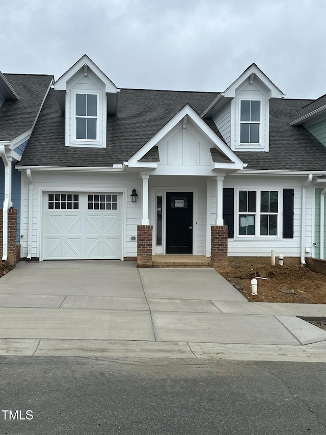 1739 Old Fields Blvd, Haw River, NC 27258 - view of front of house with driveway, a shingled roof, and an attached garage