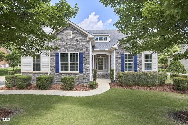 2916 Reynolda Cir, Durham, NC 27712 - view of front of house with stone siding, a front yard, and a shingled roof