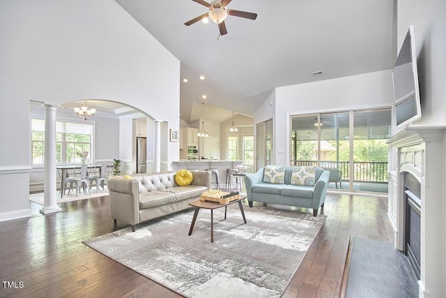 2916 Reynolda Cir, Durham, NC 27712 - living area with high vaulted ceiling, ceiling fan, a chandelier, hardwood / wood-style floors, and decorative columns