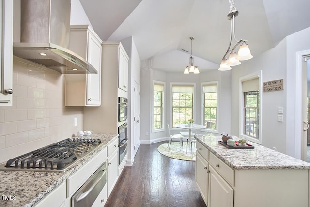 2916 Reynolda Cir, Durham, NC 27712 - kitchen with wall chimney exhaust hood, stainless steel gas stovetop, a warming drawer, lofted ceiling, and dark wood finished floors