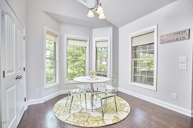 2916 Reynolda Cir, Durham, NC 27712 - dining room featuring a chandelier, baseboards, dark wood-style flooring, and vaulted ceiling