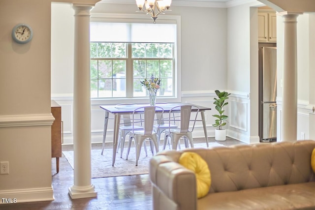 2916 Reynolda Cir, Durham, NC 27712 - dining area with ornate columns, plenty of natural light, arched walkways, ornamental molding, and wood finished floors