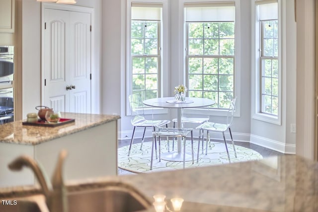 2916 Reynolda Cir, Durham, NC 27712 - dining space with baseboards and wood finished floors