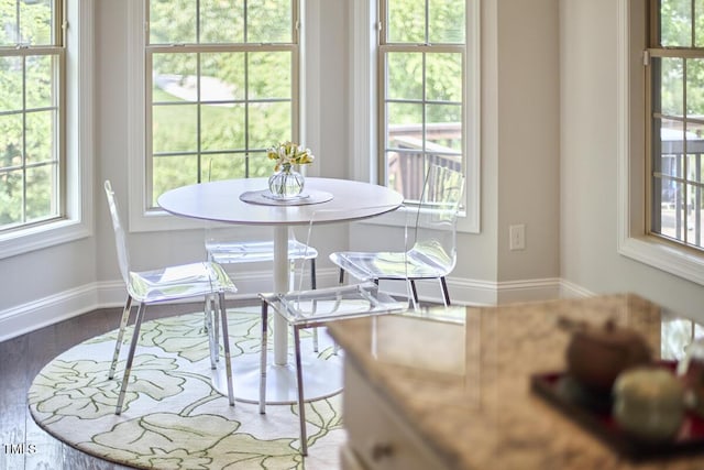 2916 Reynolda Cir, Durham, NC 27712 - dining room with baseboards, healthy amount of natural light, and wood finished floors
