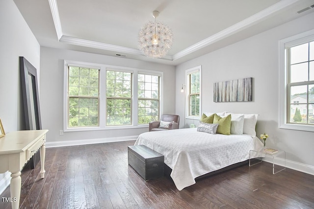 2916 Reynolda Cir, Durham, NC 27712 - bedroom featuring a raised ceiling, a chandelier, crown molding, dark wood-type flooring, and baseboards