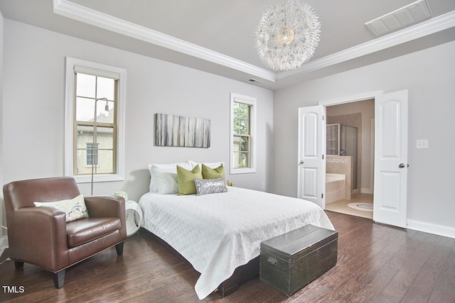 2916 Reynolda Cir, Durham, NC 27712 - bedroom with a raised ceiling, crown molding, dark wood-type flooring, baseboards, and ensuite bath