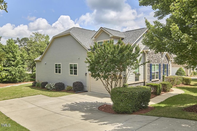 2916 Reynolda Cir, Durham, NC 27712 - view of side of property with a yard, driveway, a garage, and a shingled roof