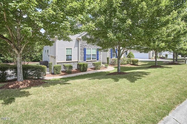 2916 Reynolda Cir, Durham, NC 27712 - obstructed view of property featuring stone siding, a front lawn, and a garage