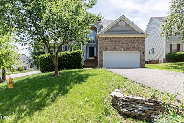 5501 Southern Cross Ave, Raleigh, NC 27606 - view of front of home with brick siding, asphalt driveway, a front lawn, and an attached garage
