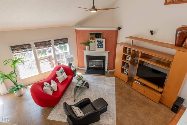 5501 Southern Cross Ave, Raleigh, NC 27606 - tiled living area with lofted ceiling, a ceiling fan, and a fireplace with flush hearth