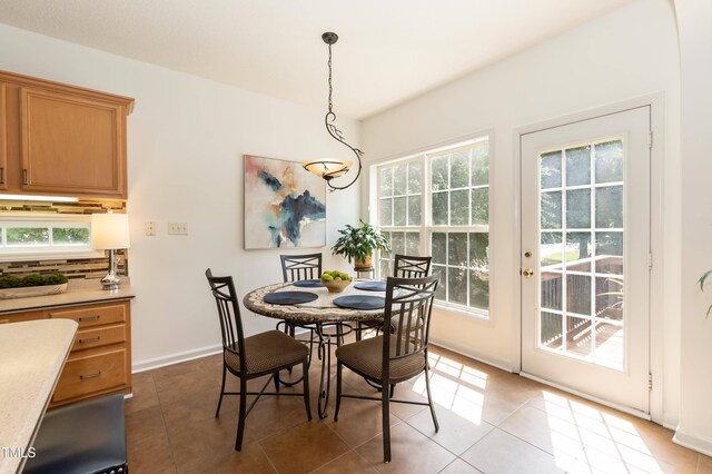 5501 Southern Cross Ave, Raleigh, NC 27606 - tiled dining space with baseboards