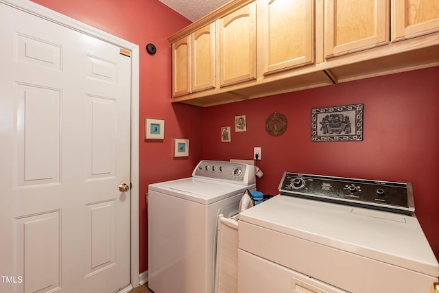 5501 Southern Cross Ave, Raleigh, NC 27606 - laundry area with cabinet space and washer and clothes dryer