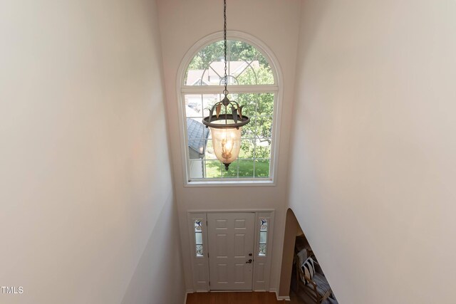 5501 Southern Cross Ave, Raleigh, NC 27606 - foyer entrance with a chandelier, a high ceiling, and dark wood-type flooring
