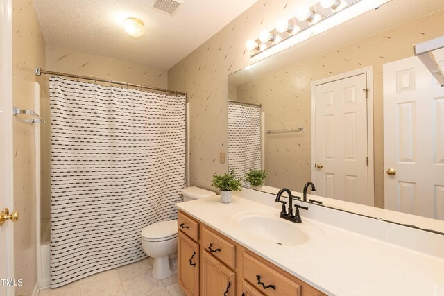 5501 Southern Cross Ave, Raleigh, NC 27606 - bathroom featuring toilet, vanity, tile patterned floors, and shower / bath combo