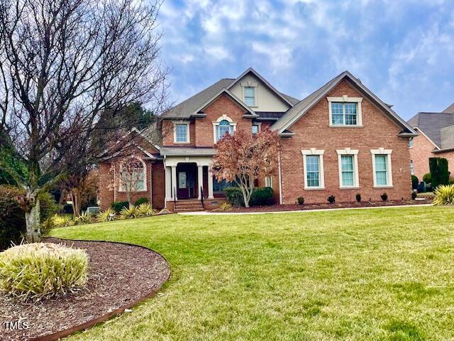 1010 Mill Pointe Way, Elon, NC 27244 - view of front of property featuring brick siding and a front yard