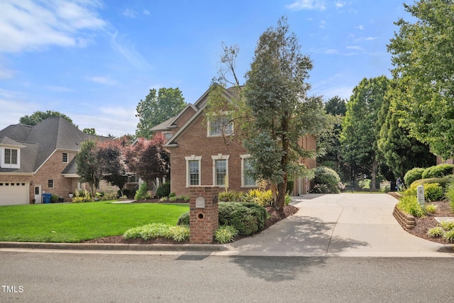 1010 Mill Pointe Way, Elon, NC 27244 - traditional-style house with a front yard, brick siding, and concrete driveway