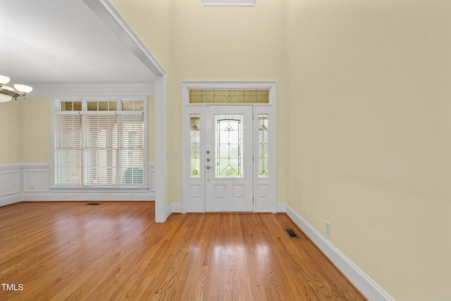 1010 Mill Pointe Way, Elon, NC 27244 - entryway featuring a chandelier, light wood-type flooring, and baseboards