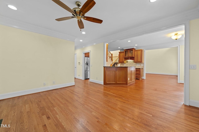 1010 Mill Pointe Way, Elon, NC 27244 - unfurnished living room with crown molding, stairway, a ceiling fan, recessed lighting, and baseboards