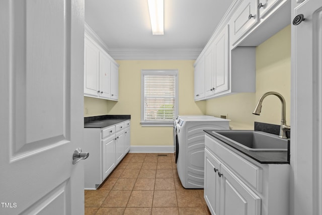 1010 Mill Pointe Way, Elon, NC 27244 - laundry room featuring cabinet space, baseboards, ornamental molding, washing machine and clothes dryer, and light tile patterned flooring