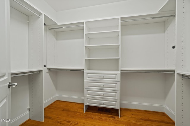 1010 Mill Pointe Way, Elon, NC 27244 - spacious closet featuring wood finished floors
