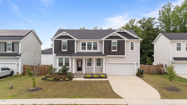 craftsman house with a garage, driveway, a porch, and board and batten siding