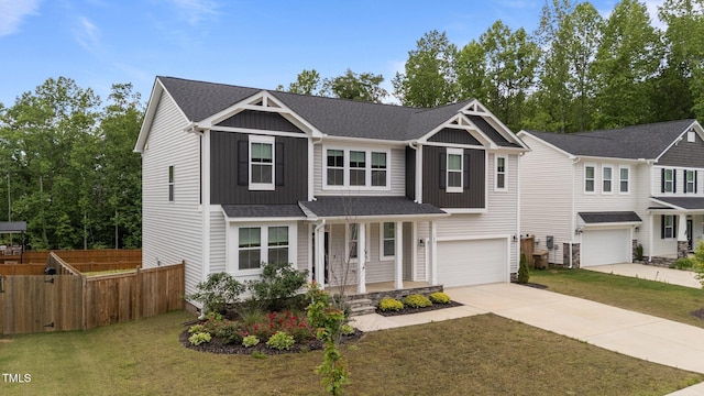 view of front of house with covered porch, driveway, an attached garage, and board and batten siding