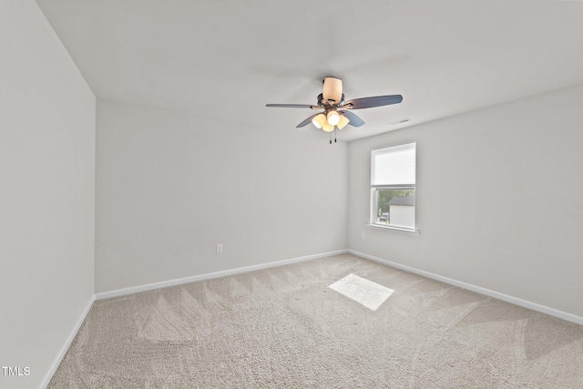 unfurnished room with carpet flooring, baseboards, and ceiling fan