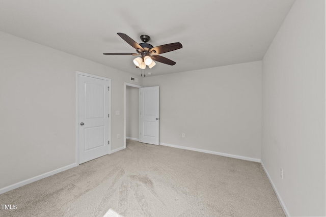 unfurnished bedroom featuring carpet floors, baseboards, and a ceiling fan