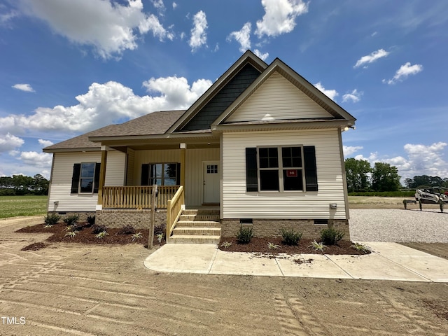 1458 Union Grove Church Rd, Fremont, NC 27830 - view of front facade featuring crawl space, covered porch, and dirt driveway