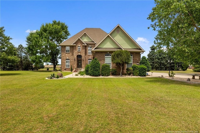craftsman-style house with a front lawn and brick siding