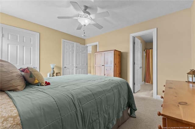 bedroom with light carpet, baseboards, and ceiling fan