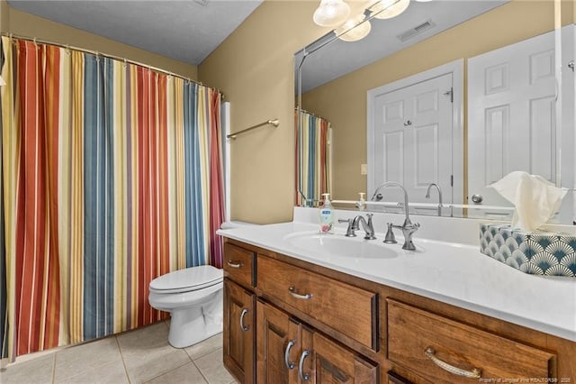full bath featuring tile patterned floors, toilet, and vanity
