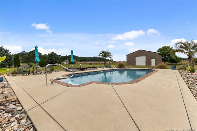 outdoor pool featuring a patio area and an outdoor structure