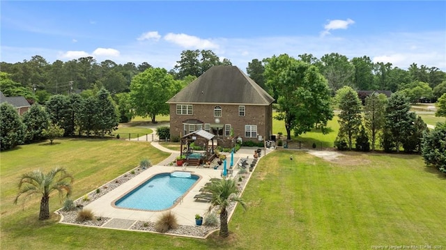 back of house featuring a gazebo, a patio area, and an outdoor pool
