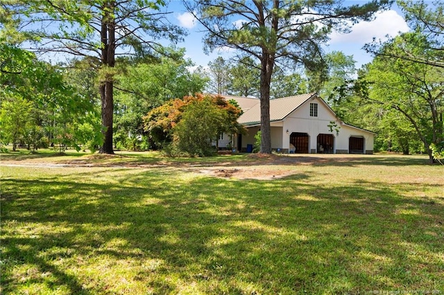 3229 Mcqueen Rd, Red Springs, NC 28377 - view of front facade with a front yard and a detached garage