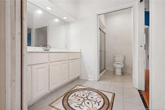 3229 Mcqueen Rd, Red Springs, NC 28377 - bathroom featuring baseboards, toilet, vanity, a stall shower, and tile patterned floors
