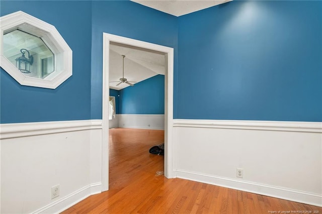 3229 Mcqueen Rd, Red Springs, NC 28377 - unfurnished room with ceiling fan, wainscoting, wood finished floors, and lofted ceiling