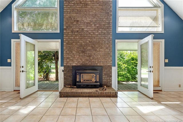 3229 Mcqueen Rd, Red Springs, NC 28377 - doorway to outside featuring tile patterned flooring, french doors, a wainscoted wall, a towering ceiling, and plenty of natural light