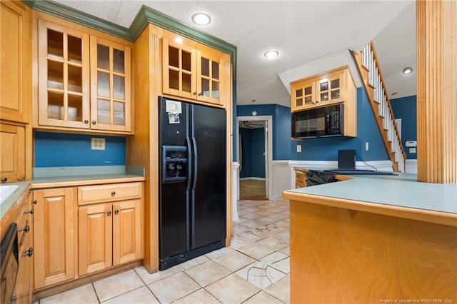 3229 Mcqueen Rd, Red Springs, NC 28377 - kitchen with black appliances, light tile patterned flooring, glass insert cabinets, light countertops, and recessed lighting