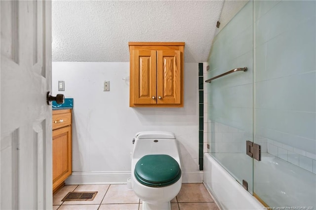 3229 Mcqueen Rd, Red Springs, NC 28377 - bathroom featuring toilet, tile patterned flooring, enclosed tub / shower combo, and a textured ceiling