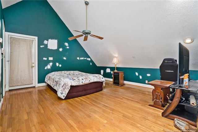 3229 Mcqueen Rd, Red Springs, NC 28377 - bedroom with lofted ceiling, hardwood / wood-style floors, baseboards, and a ceiling fan