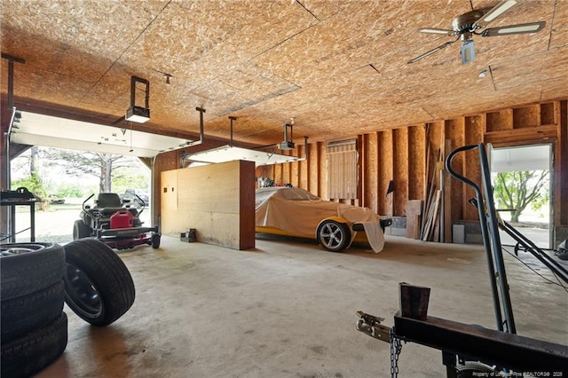 3229 Mcqueen Rd, Red Springs, NC 28377 - garage with a garage door opener and ceiling fan