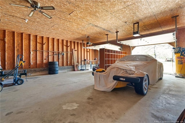 3229 Mcqueen Rd, Red Springs, NC 28377 - garage with water heater and a garage door opener