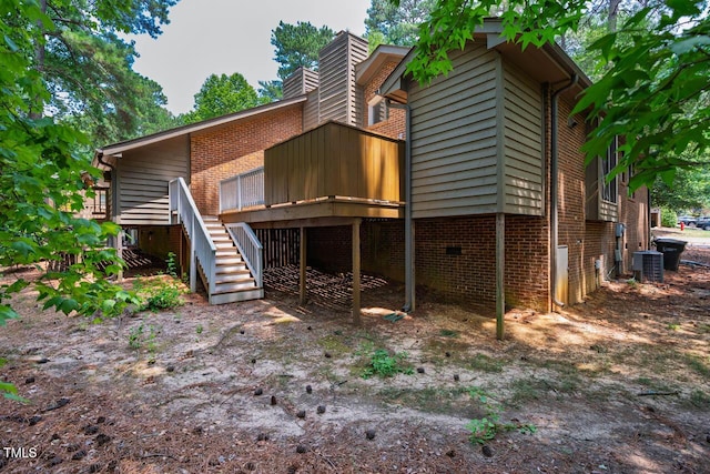 200 W Woodcroft Pkwy Unit 52A, Durham, NC 27713 - back of property featuring stairs, a deck, and a chimney