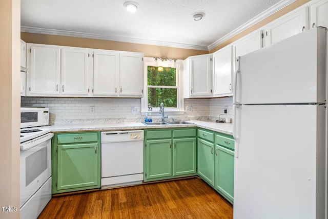 200 W Woodcroft Pkwy Unit 52A, Durham, NC 27713 - kitchen with white appliances, crown molding, dark wood-type flooring, light countertops, and green cabinets