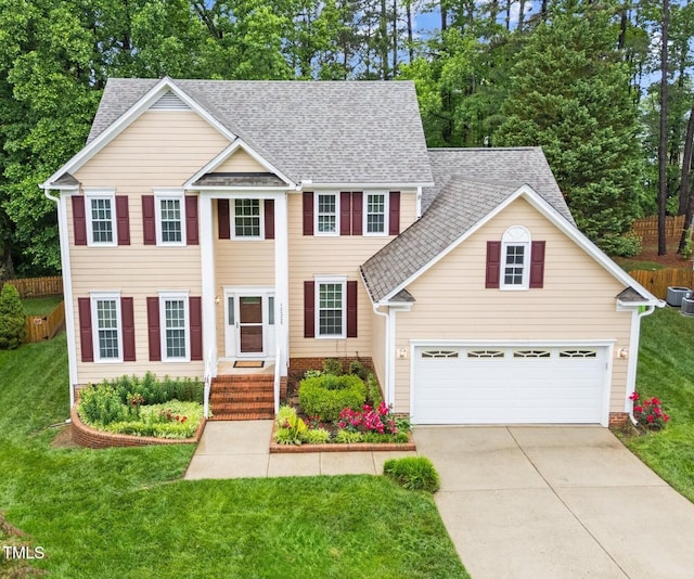 view of front of home featuring driveway, roof with shingles, central air condition unit, and an attached garage