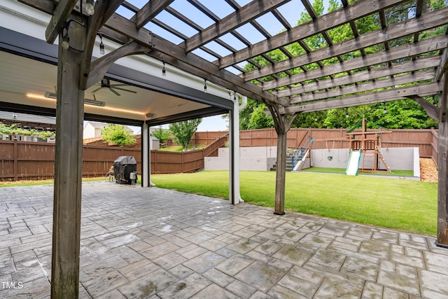 view of patio featuring a playground, a pergola, and area for grilling